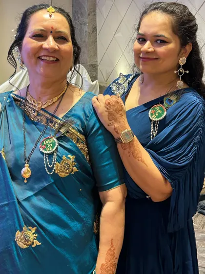 A happy picture of my favorite clients. The mother is wearing a classic bun and the daughter has soft waves.