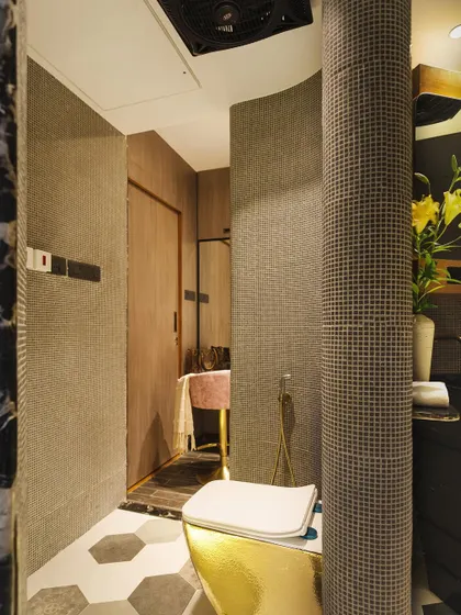 The walk-in closet area, featuring curved walls with mosaic tiles and a distinct separation of spaces for a luxurious experience.