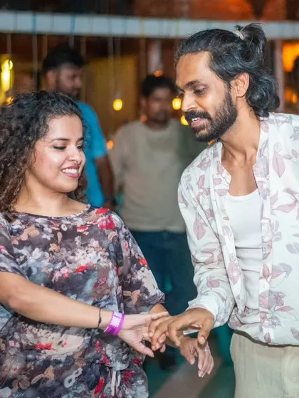 A close and connected dance, with both partners lost in the music.