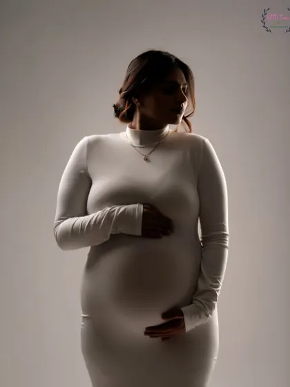 A close-up silhouette in a simple white dress. This technique uses light and shadow to create a soft, intimate, and artistic portrait.