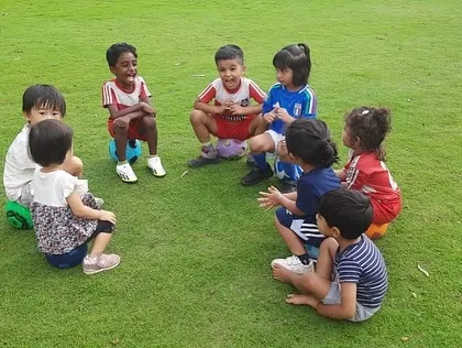 A quiet moment of connection as the kids sit in a circle, listening and sharing with each other.