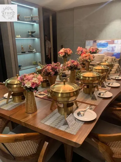 Big or small, every event gets our full attention. Here’s a beautiful buffet we set up for an intimate gathering at home, complete with our signature brass serveware and elegant floral decor. We prove that you don't need a huge guest list to have a lavish food experience.