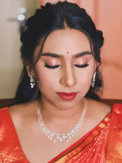 A detailed shot of Sirisha's eye makeup. The soft golden tones and sharp eyeliner define the eyes without feeling heavy, perfect for a traditional ceremony.