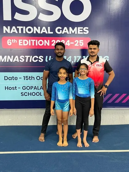 Two of our national competitors with their coaches. Our coaching team provides expert guidance every step of the way.