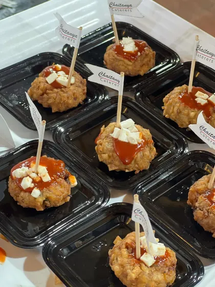 My Chinese Nest appetizer is a crunchy, savory bite-sized snack, perfect for passing around at cocktail hours. It's topped with a spicy sauce and paneer for extra flavor.