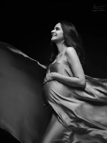 There is so much joy in simplicity. A single piece of fabric and the right light can create a timeless, high-contrast black and white portrait that feels both powerful and happy.
