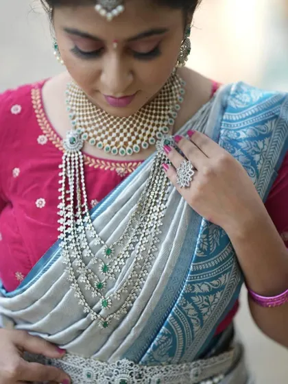 A close-up of the layered CZ haram. The intricate design and the way it drapes is just perfect for creating a look of modern luxury.