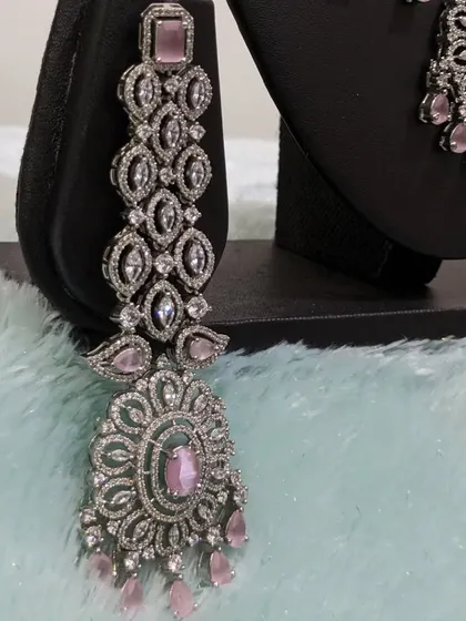 The statement earrings are designed to be seen, adding glamour and length.