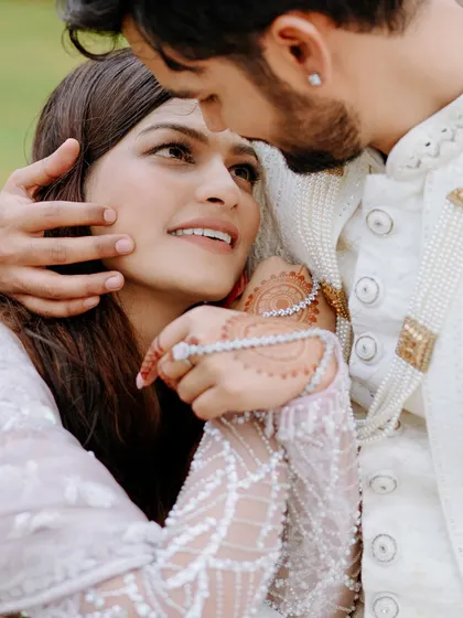 An intimate close-up of the couple, their faces close, capturing the tenderness and love in their eyes.