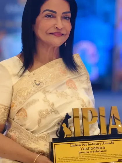 A close-up of my mother, Mrs. Yashodhara, with her Indian Pet Industry Award. Her strength and passion have paved the way for so much.