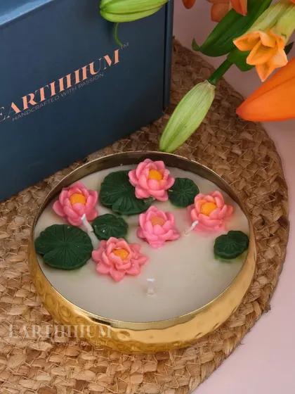 A detailed look at the hand-sculpted lotus flowers and lily pads in this Urli candle. The multiple wicks ensure an even burn and a beautiful, wide pool of light.