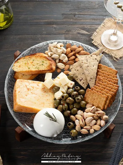 A slightly different angle of the cheese platter, showing how different compositions can be created from a single setup to give a brand more variety for their marketing.