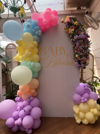 Another take on the "Baby in Bloom" theme, this time with a rainbow of pastel balloons framing the personalized backdrop.