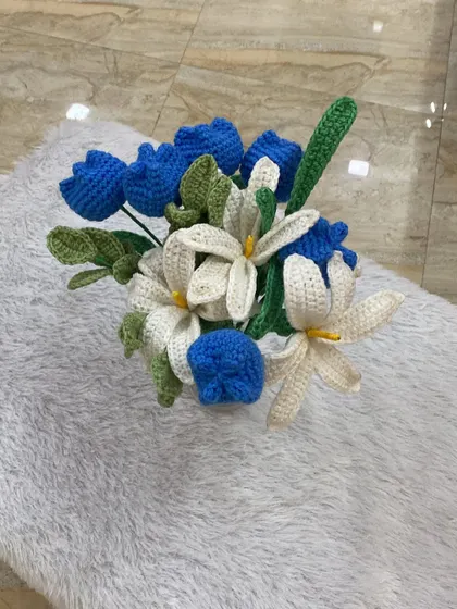 I call this my ocean blue bouquet. It features a stunning combination of deep blue tulips and delicate white lilies, creating a fresh and calming feel. I absolutely loved how this one turned out.
