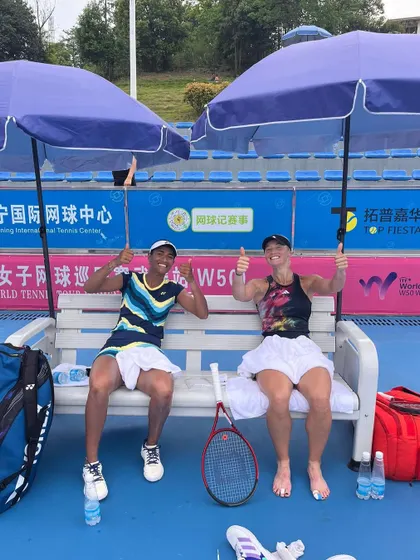 Thumbs up from the champions. Rutuja and her partner Paige Hourigan relaxing after their title win. It's important to celebrate the victories along the tough journey of the pro tour.