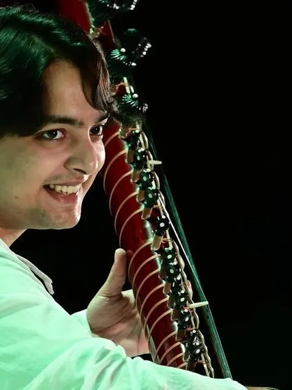 A close-up shot capturing a moment of joy during the performance. Celebrating the life and work of a legend like Kumar Gandharva Ji through music is a true blessing.