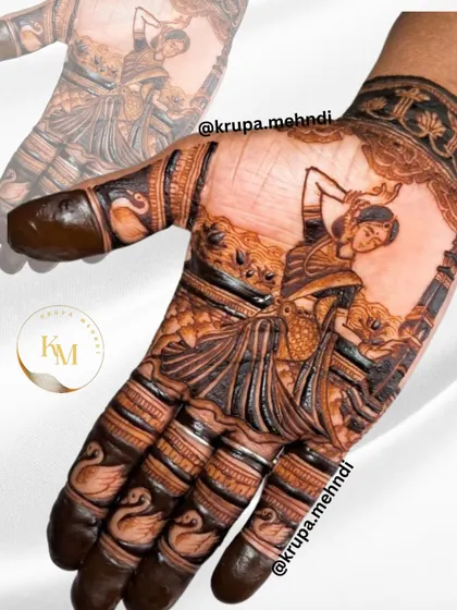Capturing the grace of a classical dancer, this portrait mehndi is for the bride who is a true artist at heart. The design flows with the movement of the dancer, surrounded by delicate swans and traditional patterns.