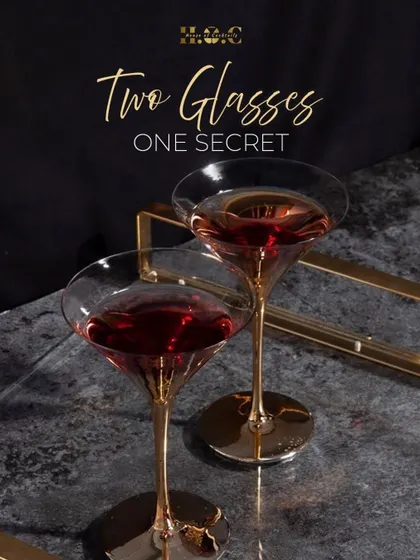 The art of the cocktail is in the details. This shot features two elegant coupe glasses with a rich, red cocktail, highlighting the premium glassware and beautiful presentation I use.