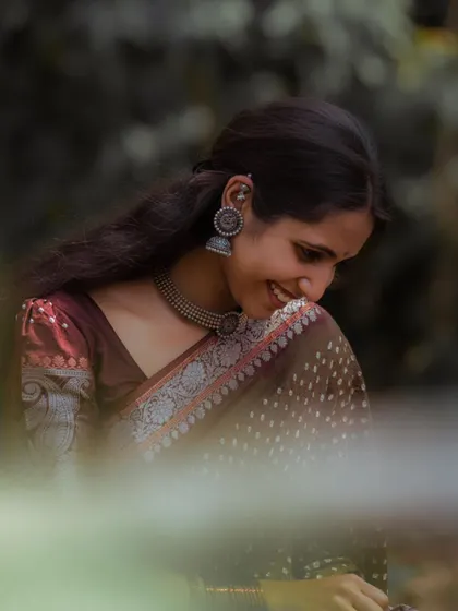 A shy smile captured during a photoshoot.