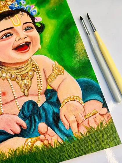 A focus on the lower half of the Bal Krishna painting, detailing his little hands and feet on the soft grass. These small details are just as important to me as the main portrait.