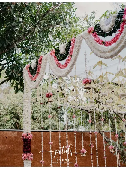 A close-up of the intricate floral and bell decorations, showcasing the craftsmanship and artistry of the design.