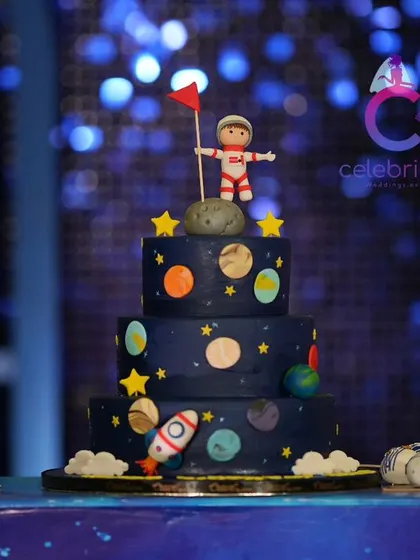 No themed party is complete without a matching cake. This amazing three-tiered space-themed cake was the centerpiece of the dessert table.