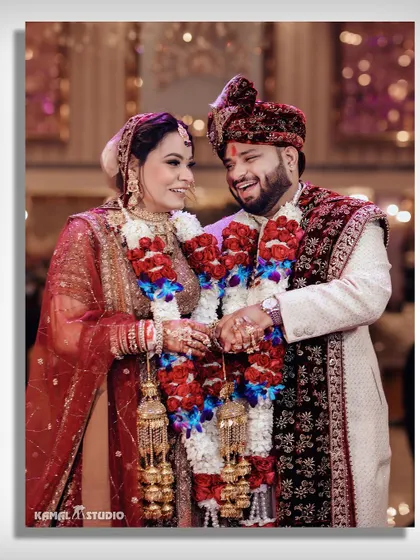 A happy, candid moment between the couple during their Varmala ceremony.