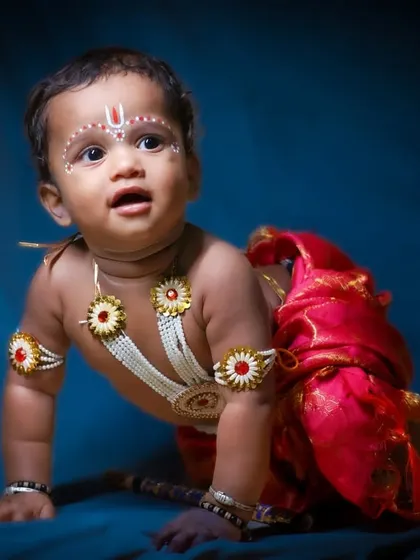 Capturing the playful side of 'Baby Krishna' as he crawls. This dynamic pose adds a sense of life and movement to the themed photoshoot.
