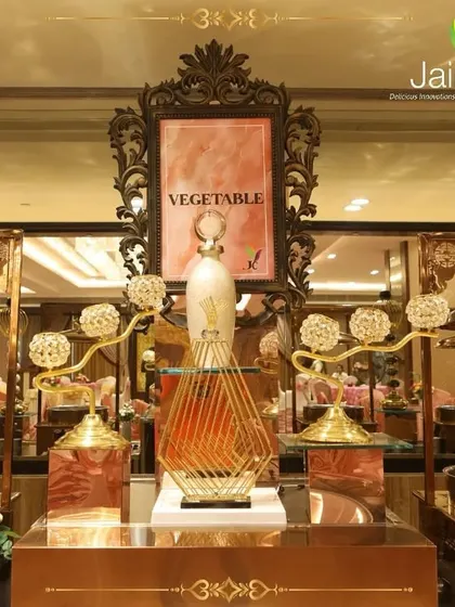An ornate vegetable station with intricate golden decor. We believe every dish, no matter how simple, deserves a presentation that makes it feel like a delicacy.