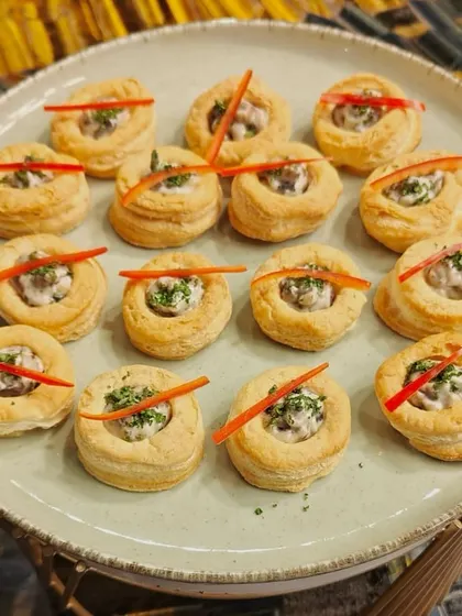 A platter of our creamy mushroom vol-au-vents. These flaky pastry cups are a classic and elegant appetizer, perfect for any gathering.