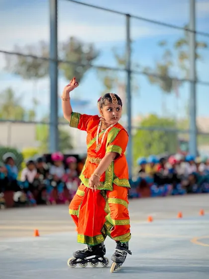 A beautiful pose from our talented young performer, Iniya, during her classical dance on skates.