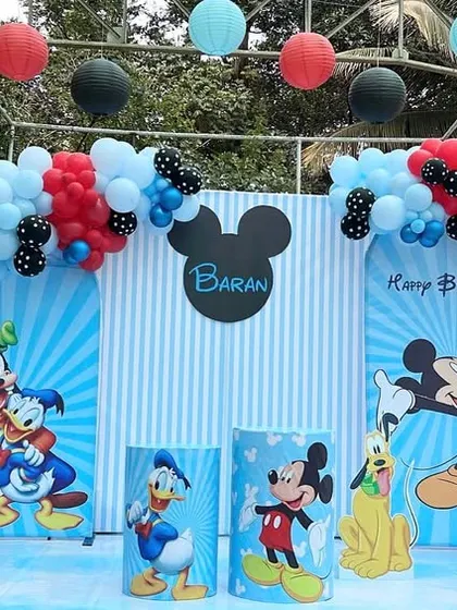 A classic Mickey Mouse and friends birthday party for Baran's third birthday. We used the iconic red, black, and blue color scheme with character cutouts of Mickey, Donald, and Pluto.