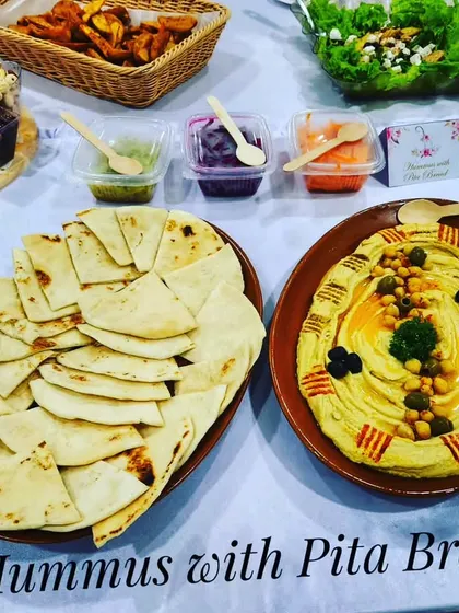 Another view of our hummus with pita bread, a healthy and delicious starter option.