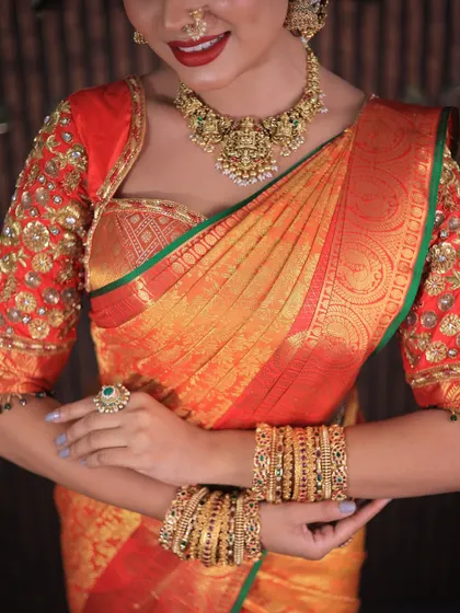 More shots of this gorgeous red and orange Kanchipuram saree. For photoshoots, I ensure every detail, from the pallu to the waist pleats, is absolutely perfect.