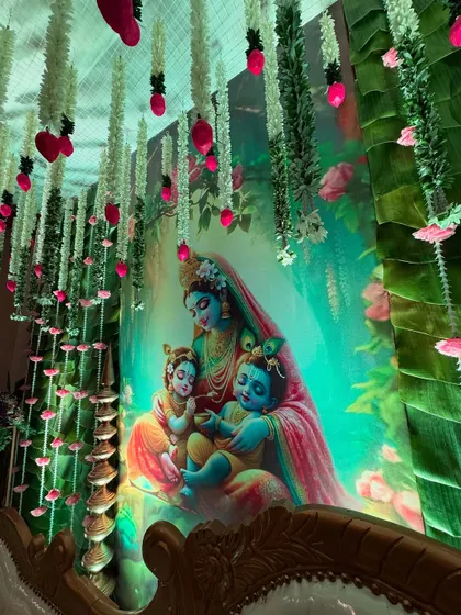 A close-up of the beautiful backdrop featuring mother Yashoda with baby Krishna, perfect for a traditional baby shower celebration.
