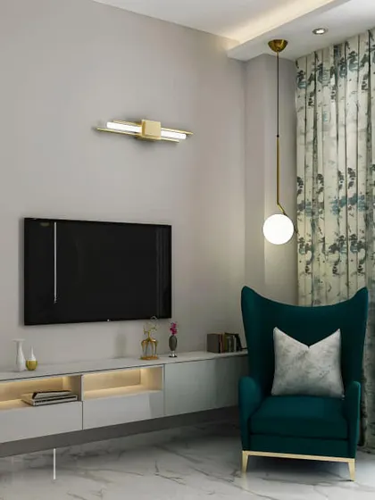 A minimalist floating white console with integrated lighting, perfect for a smaller living area or bedroom. Its simplicity allows the surrounding decor, like the wingback chair and statement lighting, to shine.