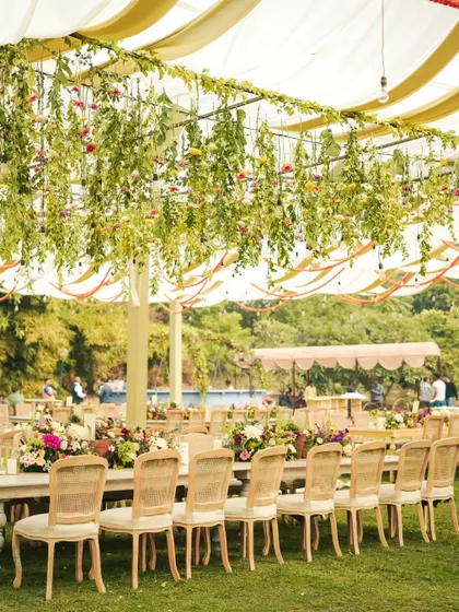 A garden of hanging florals. We created this enchanting overhead installation to hang above the dining tables, making the wedding lunch feel like an immersive, magical floral experience.