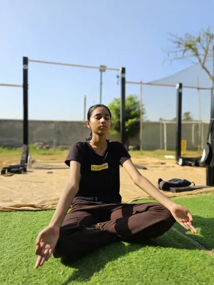 A young athlete practicing meditation, learning the importance of mental stillness and focus from a young age.
