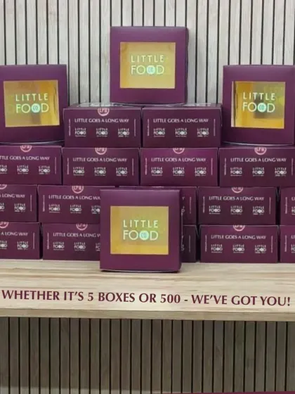 Whether it's 5 boxes or 500, I've got you covered. This image shows stacks of my signature purple boxes, ready for a large delivery, demonstrating my capability to handle orders of any size with professionalism.