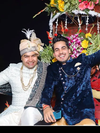 The groom's energetic arrival during the baraat, celebrating with friends and family.