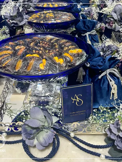 A detailed shot of the Azure Crystal Bowl Hamper, showing the personalized "AS" monogram. I work with you to add these bespoke touches that make your event gifts truly unique.