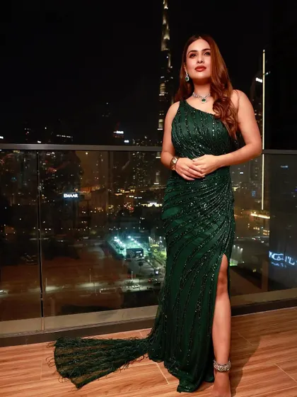 A glitter and glam look I styled for Neha Malik for an event in Dubai. This emerald green sequin gown with a dramatic train was perfect for a night out, set against the stunning backdrop of the Burj Khalifa.