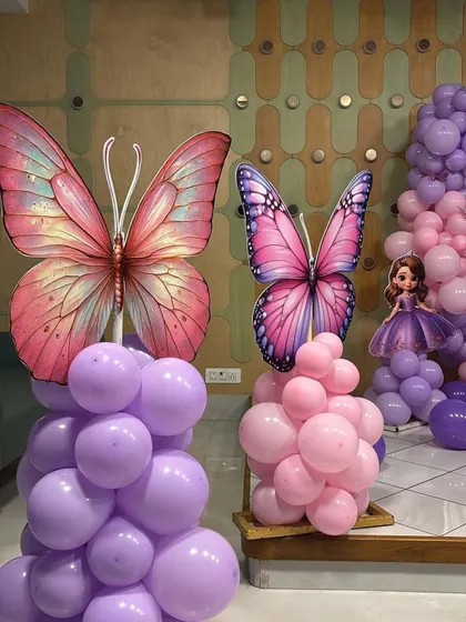 A close-up of the large, detailed butterfly cutouts used as props for the party.