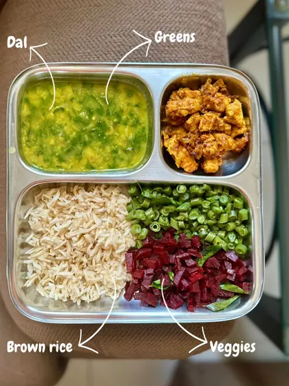 A perfectly balanced meal with brown rice, dal with greens, sautéed beetroot and beans, and pan-fried paneer.