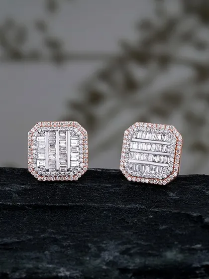 Crafted to shine, designed to captivate. These elegant stud earrings feature a mosaic of baguette and round diamonds, creating a modern and sophisticated sparkle. They are a perfect example of understated luxury.
