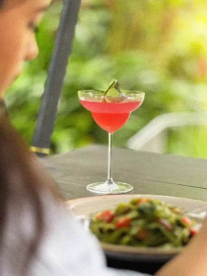 Soaking in the flavors and savoring the moment. A guest enjoying her meal in our outdoor seating area.