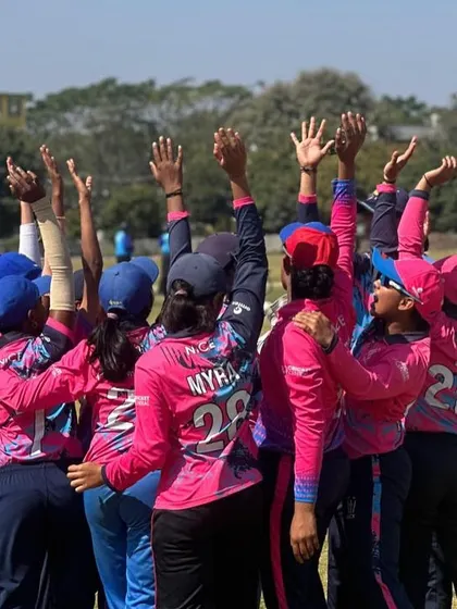 A moment of unity before lifting the trophy. The team huddle shows our togetherness, which is the foundation of our success.