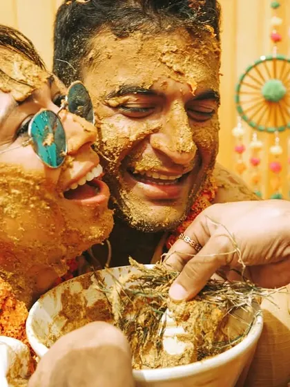 Pure, unadulterated laughter during a fun-filled Haldi ceremony. Our candid photography style ensures we capture the real emotions and hilarious moments that make your wedding celebrations unique.