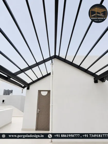 A straight-on view of the A-frame design of the black pergola, a modern take on a classic roof shape.