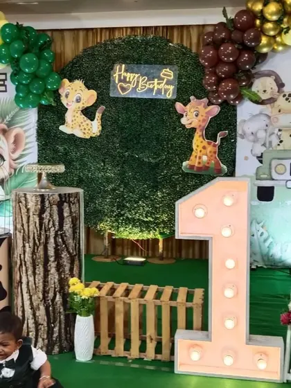 Another shot of the jungle theme, showing the detailed arrangement of animal cutouts and props on the stage.